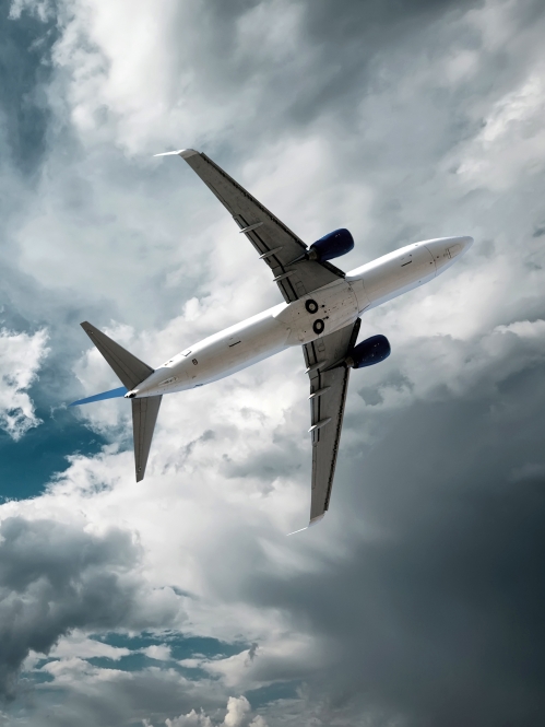 Airplane flying  the sky with clouds
